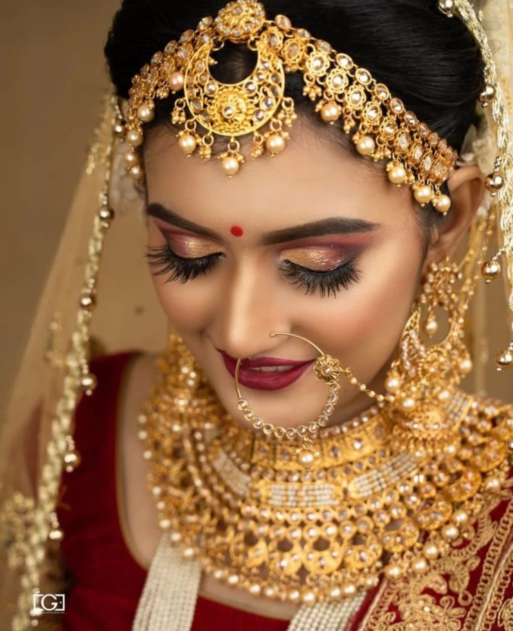 Gold bridal jewellery makeup closeup by Rajni Mitra