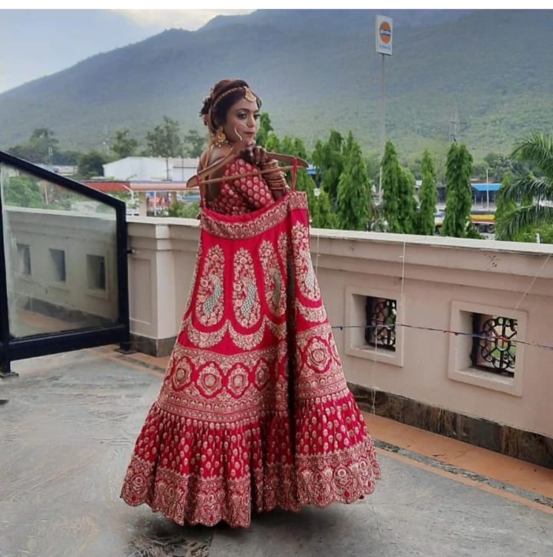 Full length red bridal look by Looks and Locks Jamshedpur