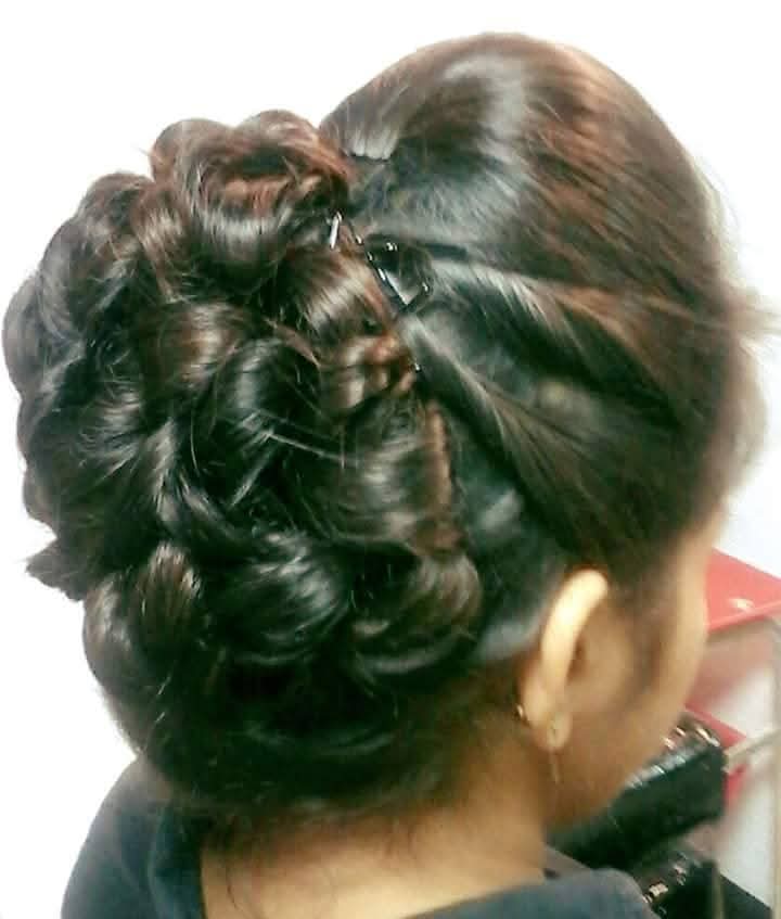 Elegant bridal hair updo finish by Looks and Locks